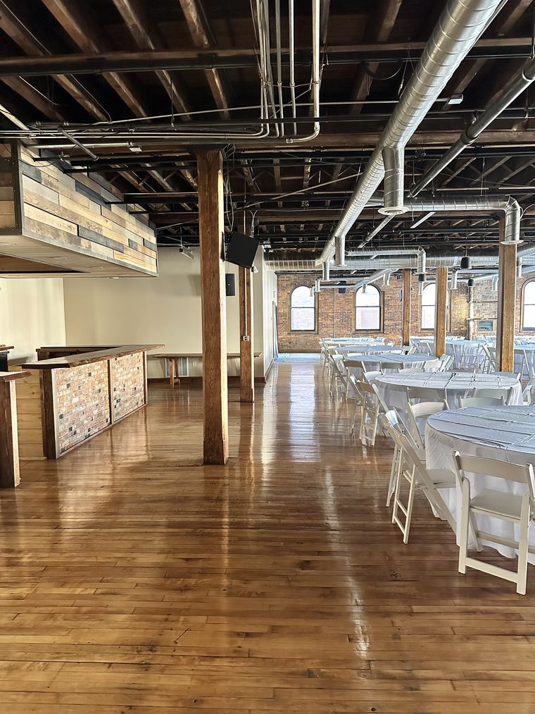 The bar under its timber canopy, with tables set beyond