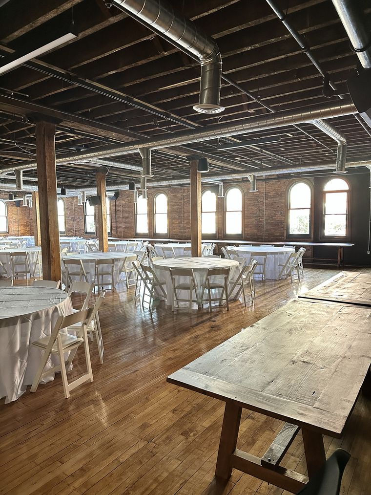 Rustic farm tables beside the dining floor