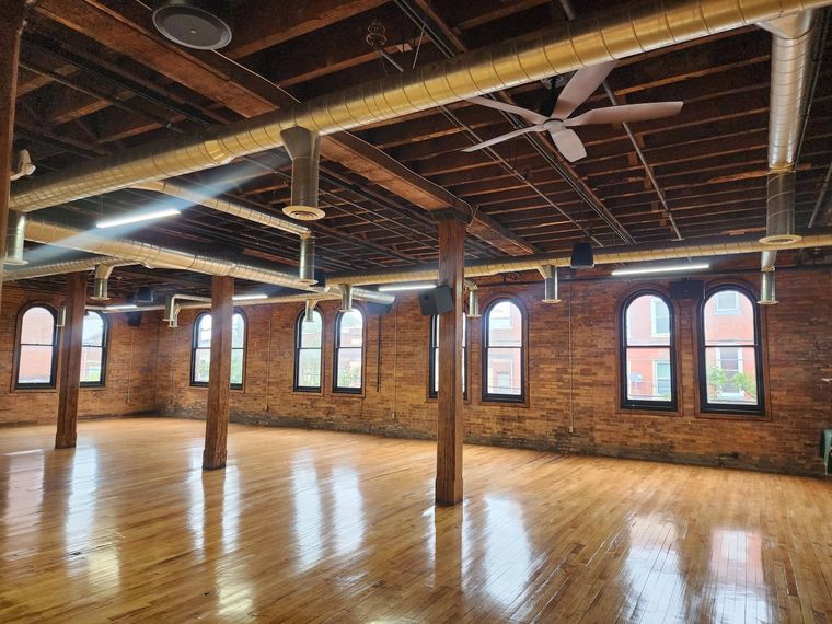 The open hall with its original hardwood floor